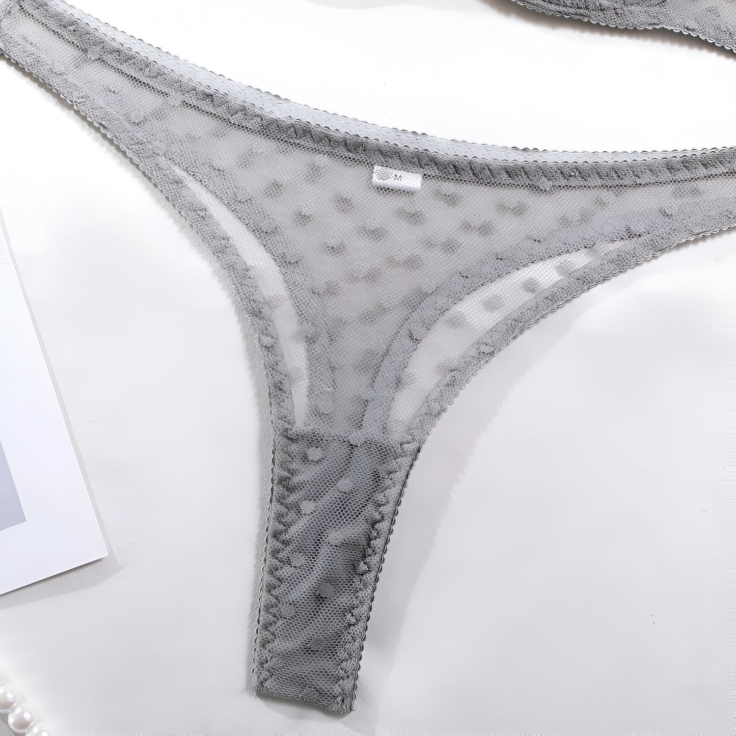 Gray lace underwear on a white background