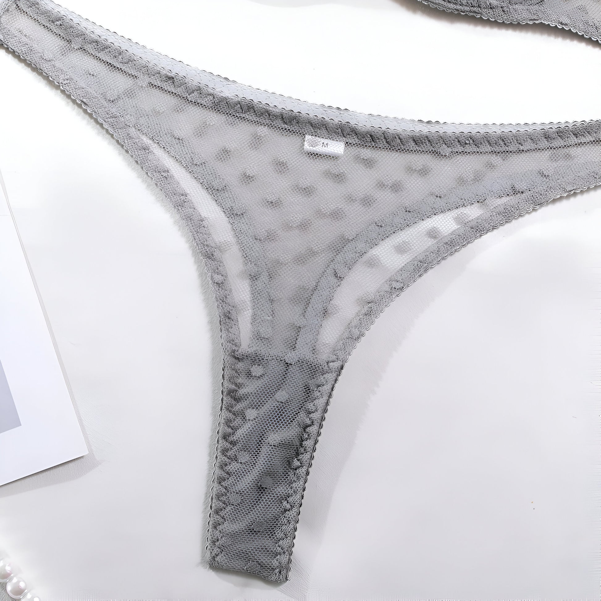 Gray lace underwear on a white background